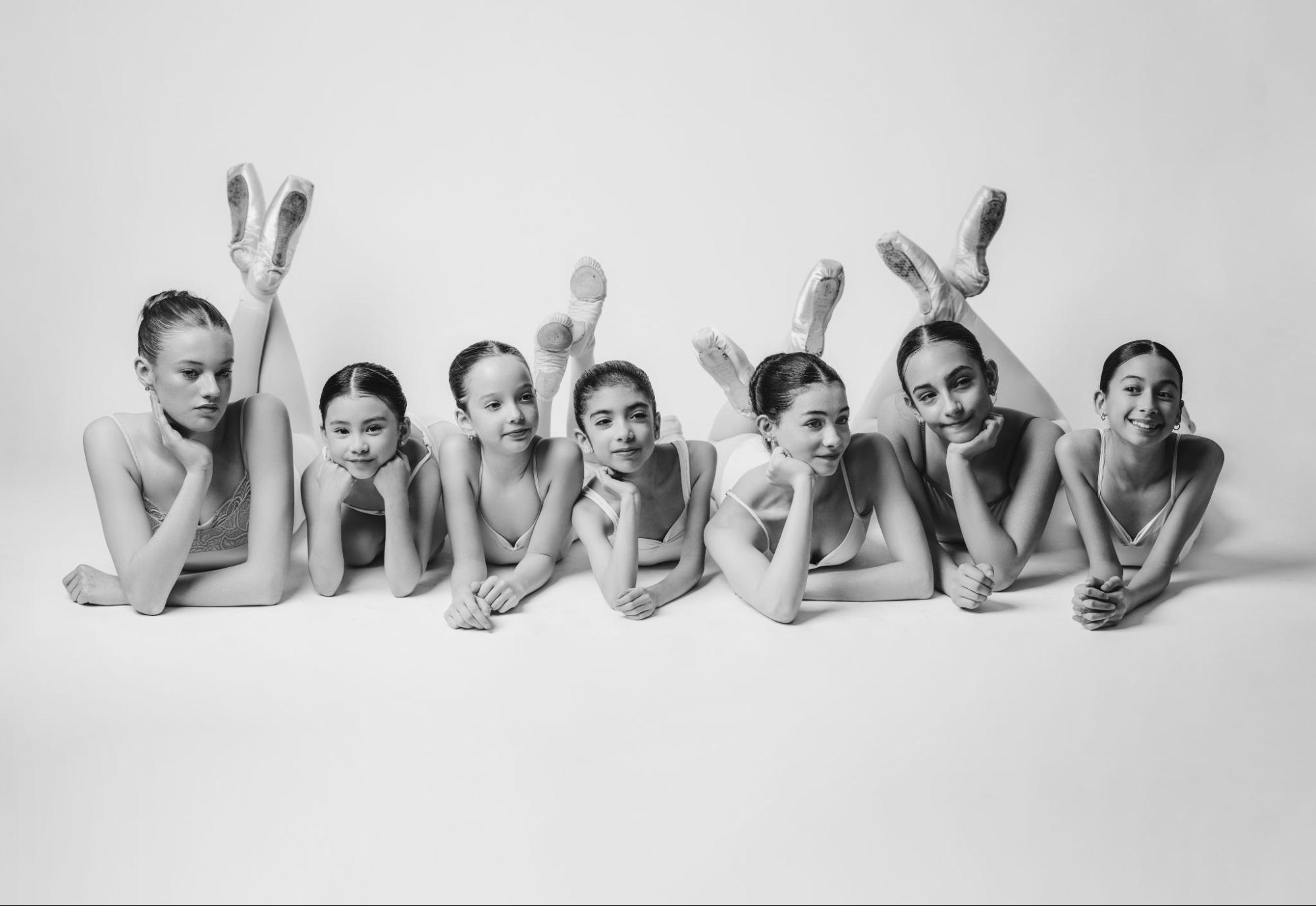 Burbank Dance Academy students of all ages lying together on the studio floor
